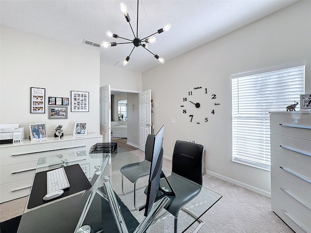 home office featuring a textured ceiling, light carpet, and a notable chandelier