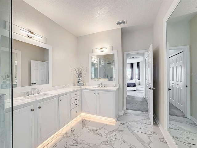 bathroom featuring vanity and a textured ceiling