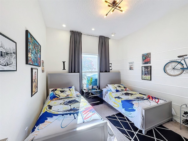 carpeted bedroom with a textured ceiling