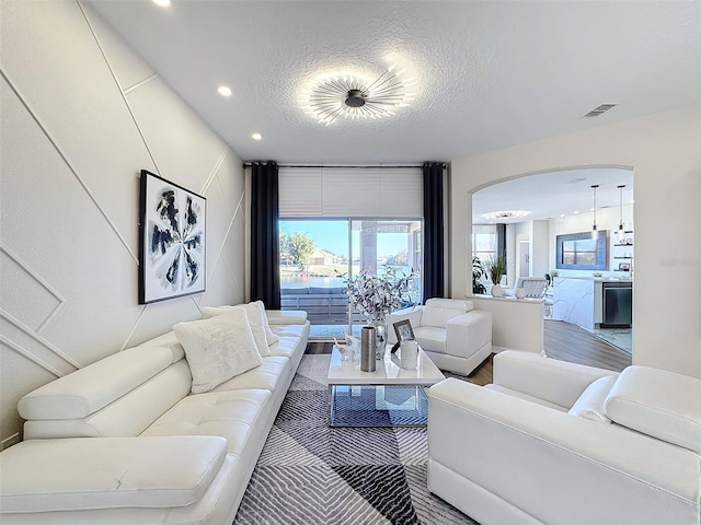 living room featuring a textured ceiling