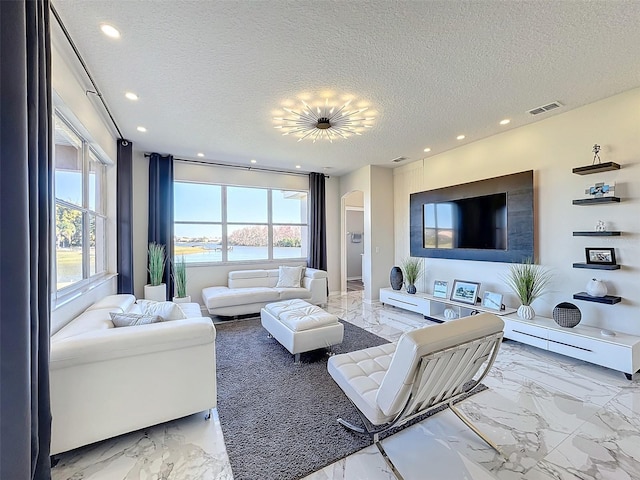 living room with a textured ceiling