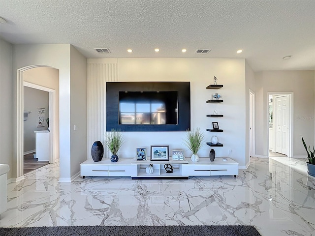 living room with a textured ceiling