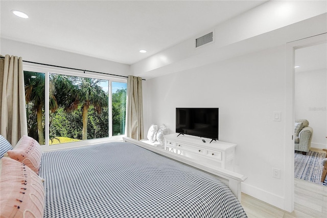 bedroom featuring light wood-type flooring