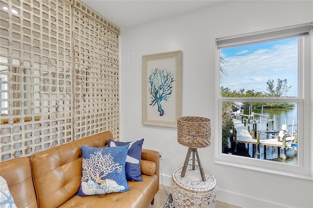 living area featuring a water view