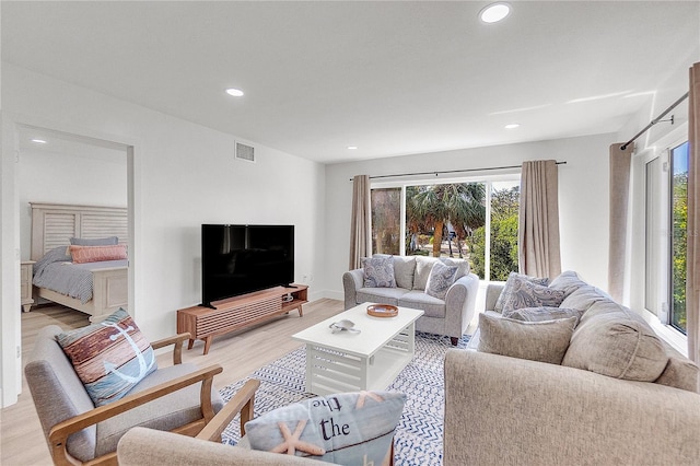 living room with light hardwood / wood-style floors