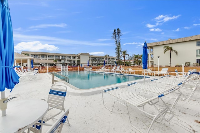 view of swimming pool with a patio area