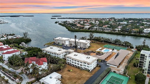 aerial view at dusk with a water view