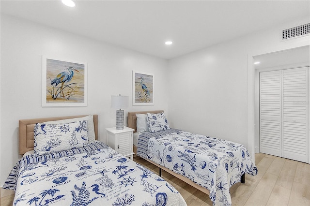 bedroom featuring a closet and light hardwood / wood-style floors