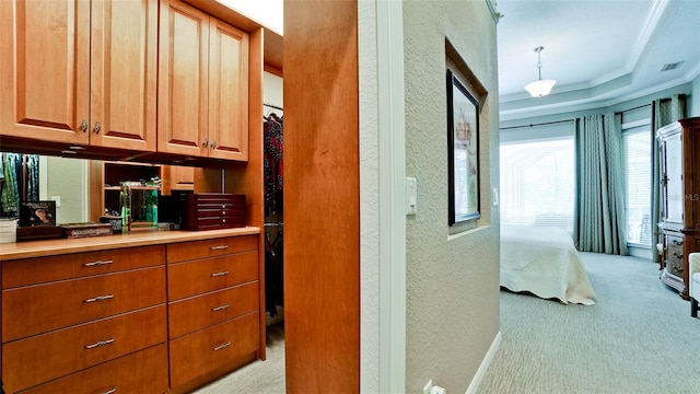 interior space featuring crown molding and light colored carpet