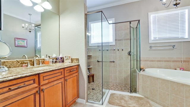 bathroom featuring separate shower and tub, crown molding, vanity, and a notable chandelier