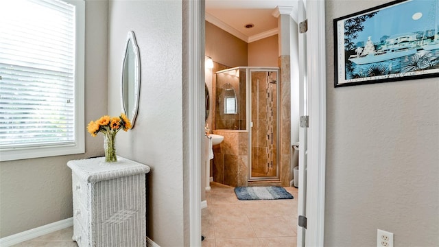 bathroom featuring tile patterned floors, crown molding, and walk in shower