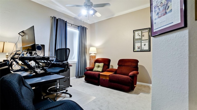 carpeted office space with ceiling fan and crown molding