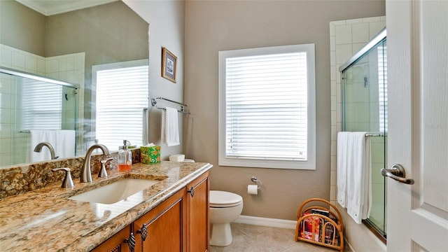 bathroom featuring tile patterned floors, plenty of natural light, vanity, and walk in shower