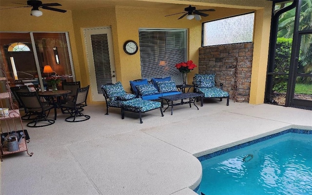 view of swimming pool featuring ceiling fan, a patio area, and an outdoor hangout area