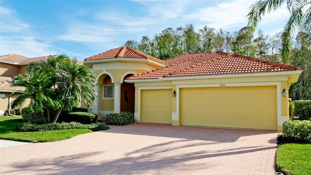 mediterranean / spanish-style home featuring a garage