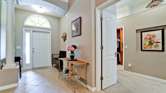 tiled entryway with ornate columns