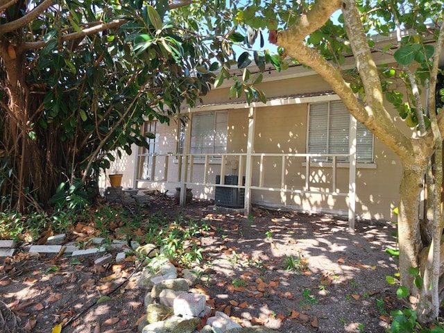 1505 N Peninsula Ave, New Smyrna Beach, FL 32169 - view of home's exterior with central AC