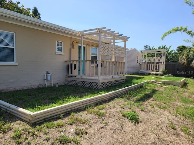 1505 N Peninsula Ave, New Smyrna Beach, FL 32169 - view of yard featuring a deck and a pergola