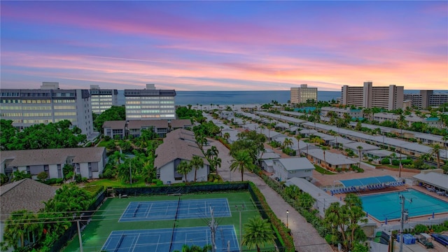 aerial view at dusk with a water view