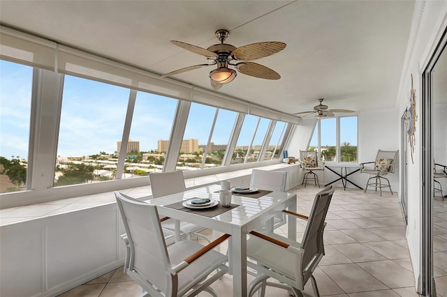 1200 E Peppertree Ln Unit 607, Sarasota, FL 34242 - sunroom featuring tile patterned floors and a city view