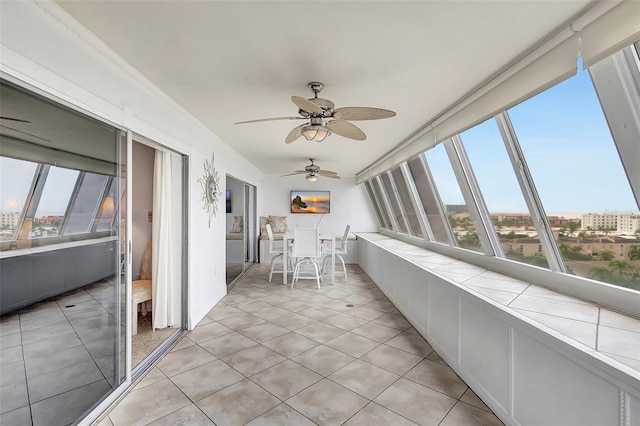 1200 E Peppertree Ln Unit 607, Sarasota, FL 34242 - sunroom featuring healthy amount of natural light and tile patterned flooring