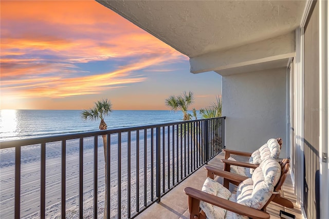 balcony at dusk with a water view