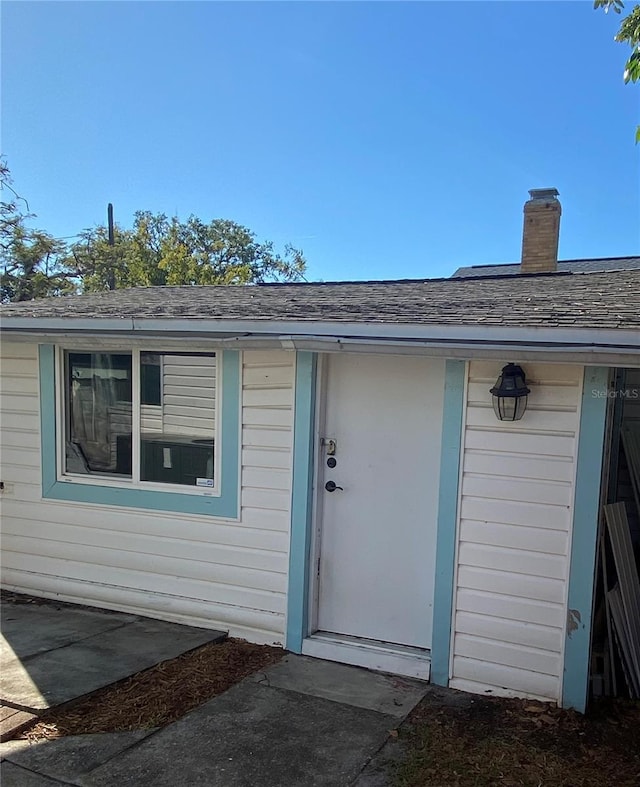 222 27th St W, Bradenton, FL 34205 - property entrance with roof with shingles