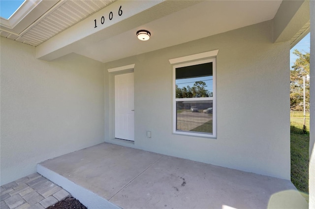 property entrance with a patio area