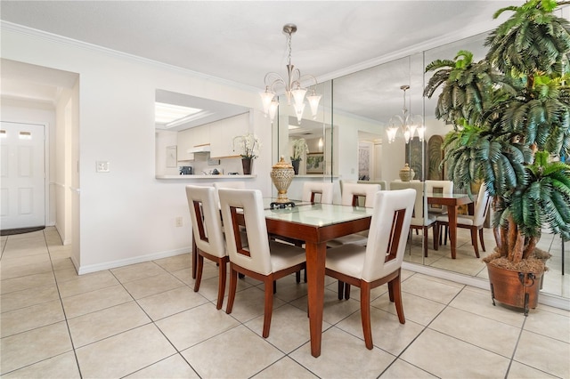 dining room featuring crown molding, light tile patterned floors, and a notable chandelier