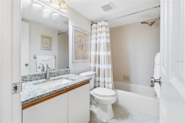 full bathroom featuring tile patterned floors, vanity, toilet, and shower / bathtub combination with curtain