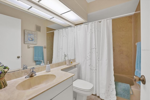 full bathroom featuring tile patterned flooring, shower / tub combo with curtain, vanity, and toilet