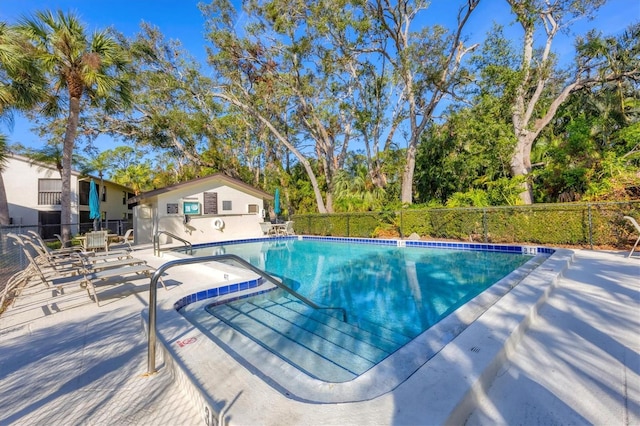 view of swimming pool featuring a patio area