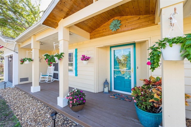 doorway to property featuring covered porch