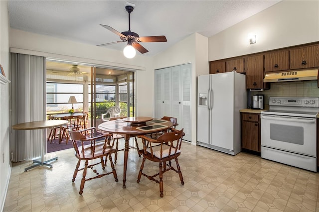 kitchen with ceiling fan, lofted ceiling, white appliances, decorative backsplash, and dark brown cabinets