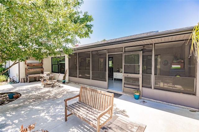 view of patio with a sunroom