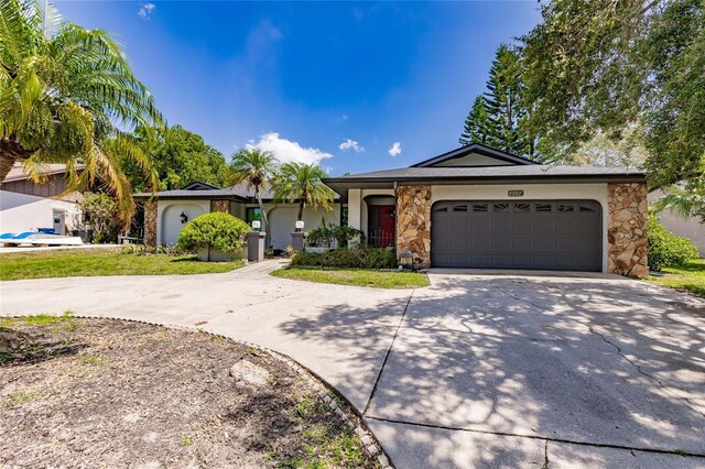 single story home with a garage