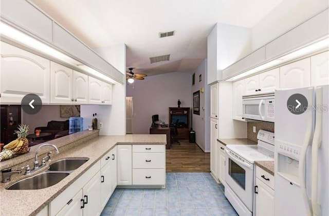7707 10th Ave NW, Bradenton, FL 34209 - kitchen with white appliances, a sink, ceiling fan, and white cabinets
