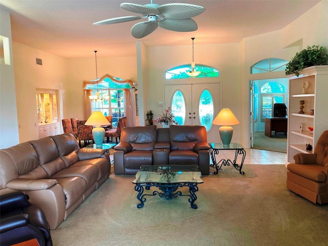 living room with french doors, light colored carpet, a wealth of natural light, and ceiling fan