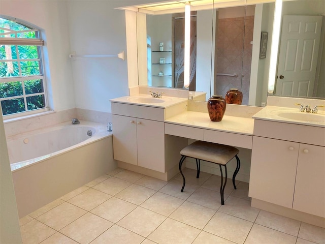 bathroom with tile patterned floors, vanity, and a bath