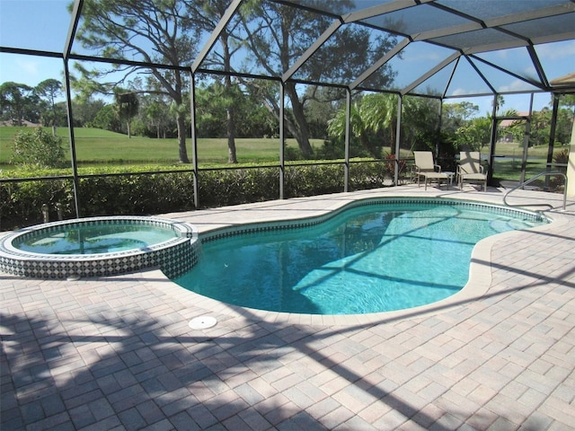 view of pool featuring glass enclosure, a patio area, and an in ground hot tub