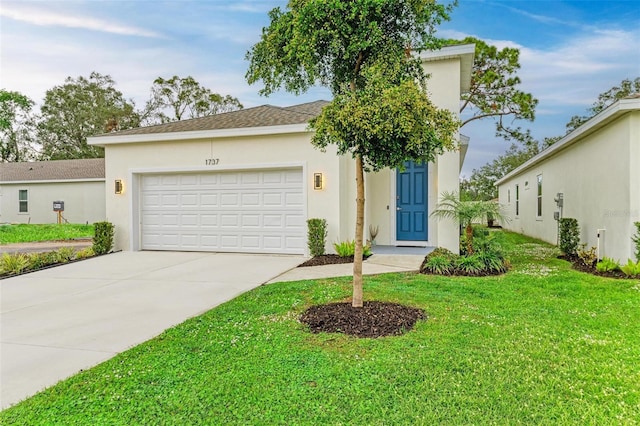 view of front of home with a front lawn and a garage