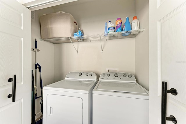 clothes washing area with washer and dryer