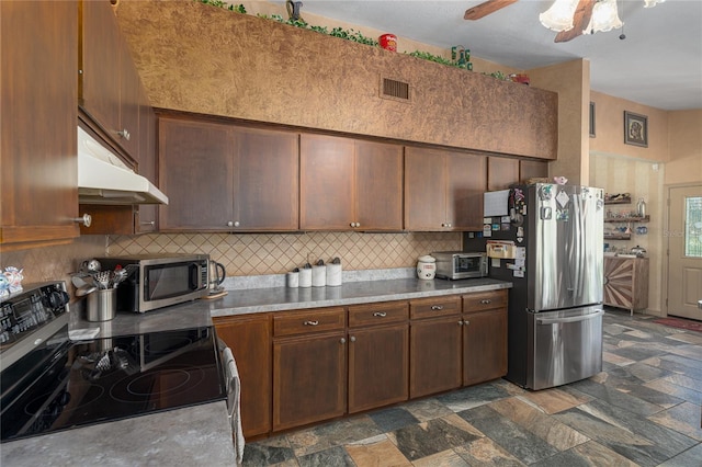 kitchen with ceiling fan, appliances with stainless steel finishes, and tasteful backsplash