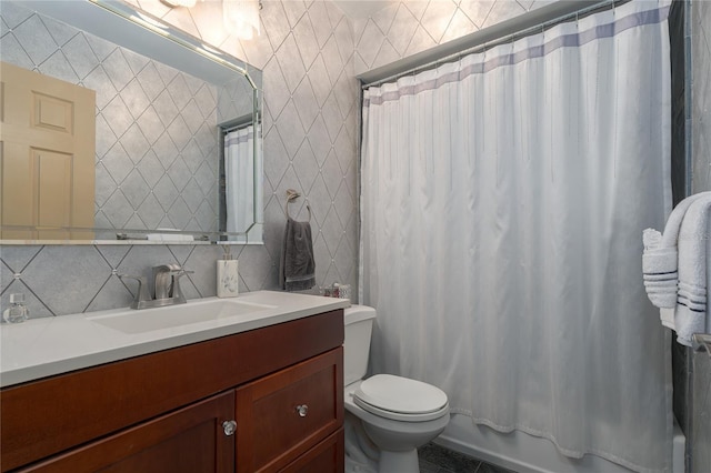 full bathroom with vanity, decorative backsplash, toilet, shower / bath combo with shower curtain, and tile walls