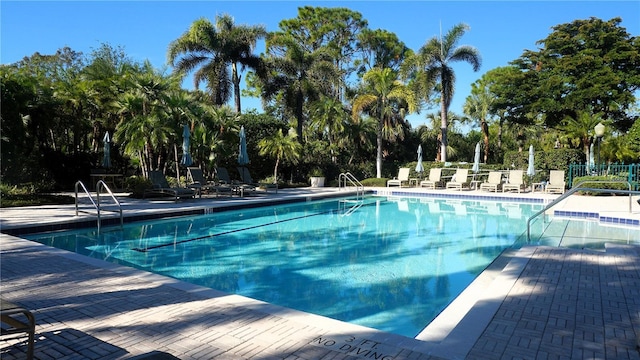 view of swimming pool with a patio