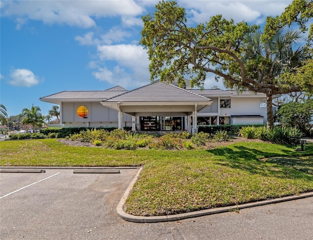 exterior space featuring a front lawn