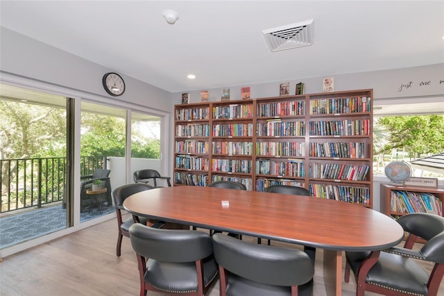 dining space with light hardwood / wood-style floors