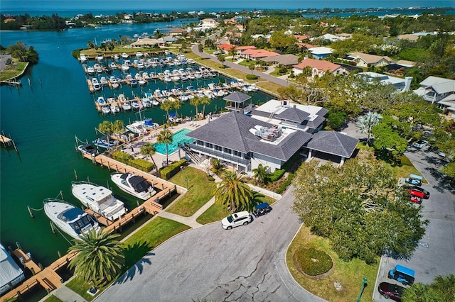 birds eye view of property with a water view