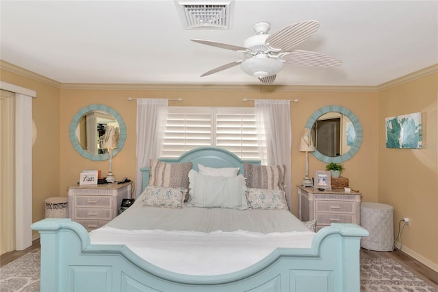 bedroom with light wood-type flooring, ceiling fan, and crown molding