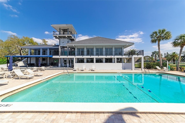 view of swimming pool with a patio area